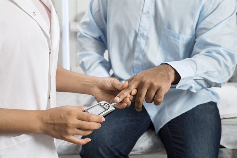 A patient getting a glucose reading.